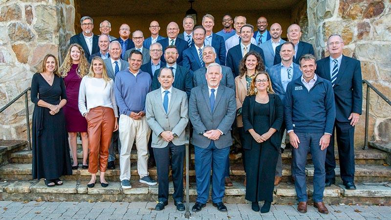 alumni trustees in front of carter hall