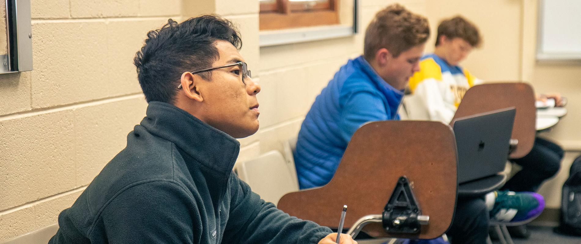 male student in classroom